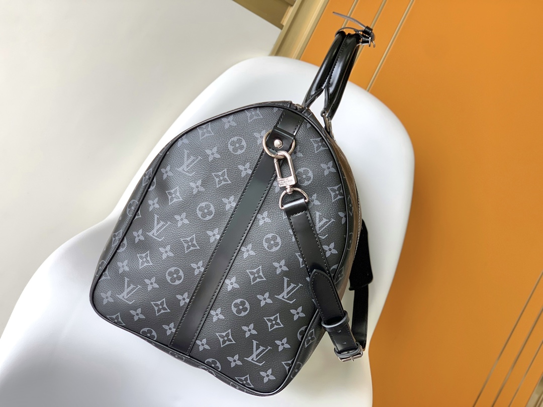 Louis Vuitton's LV latest model, a classic iconic black grey canvas travel bag, made of cut canvas