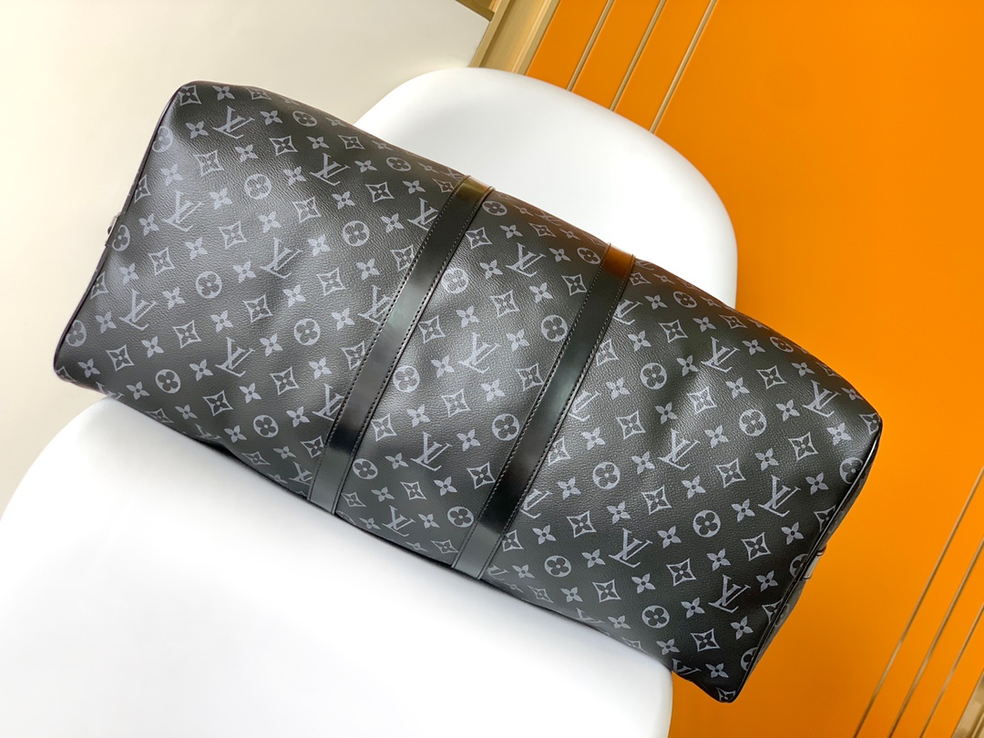 Louis Vuitton's LV latest model, a classic iconic black grey canvas travel bag, made of cut canvas