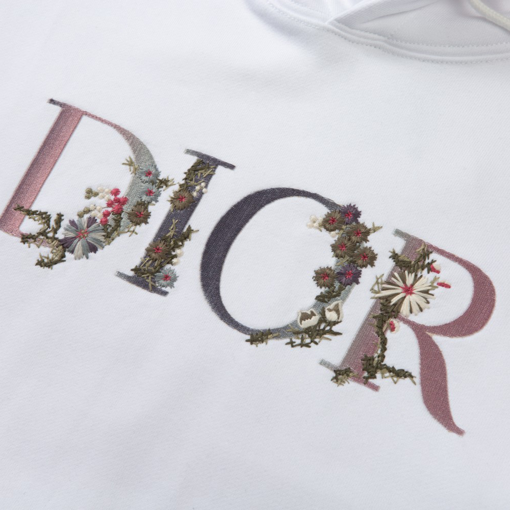 Dior's new embroidered letter patterned hoodie is available in black and white, and comes with a complete packaging box